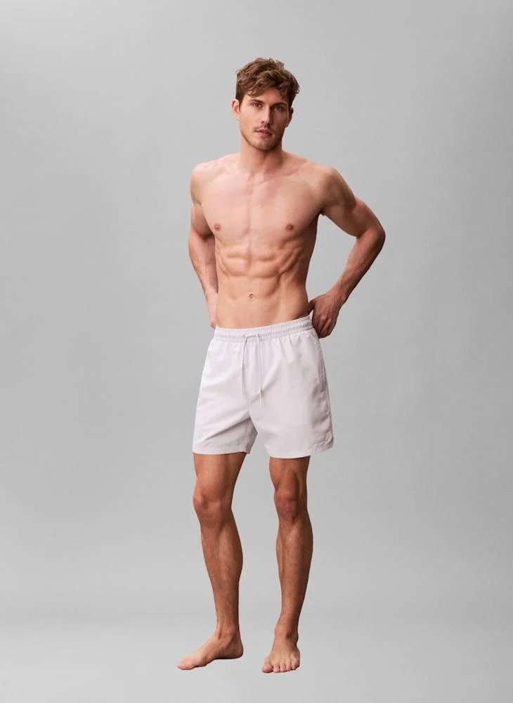 CALVIN KLEIN  Solid Swim Shorts for Men | Best Price UAE